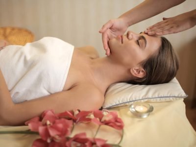 attractive-young-female-getting-massage-spa-salon-min