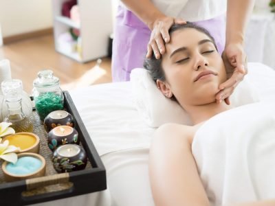 young-beautiful-woman-having-face-massage-relaxing-spa-min